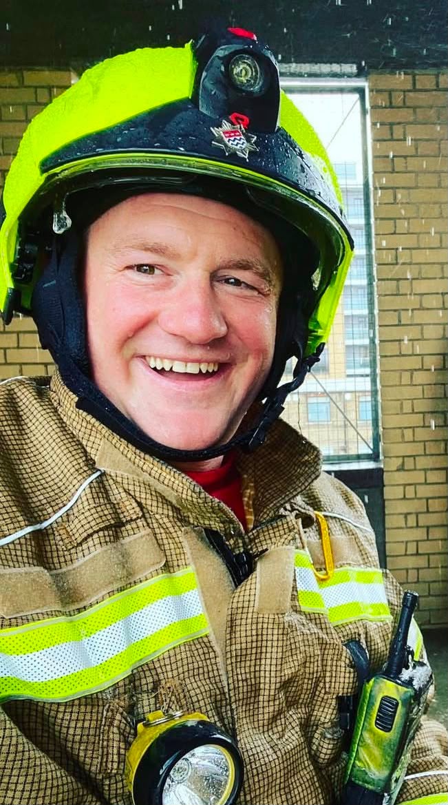 On shift. Smiling in the rain, of course.